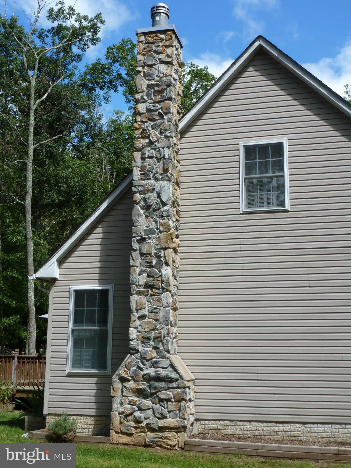 13600 Loy Wolfe Road Smithsburg, MD 21783 - Photo 8 of 28 Stone chimney is triple insulated