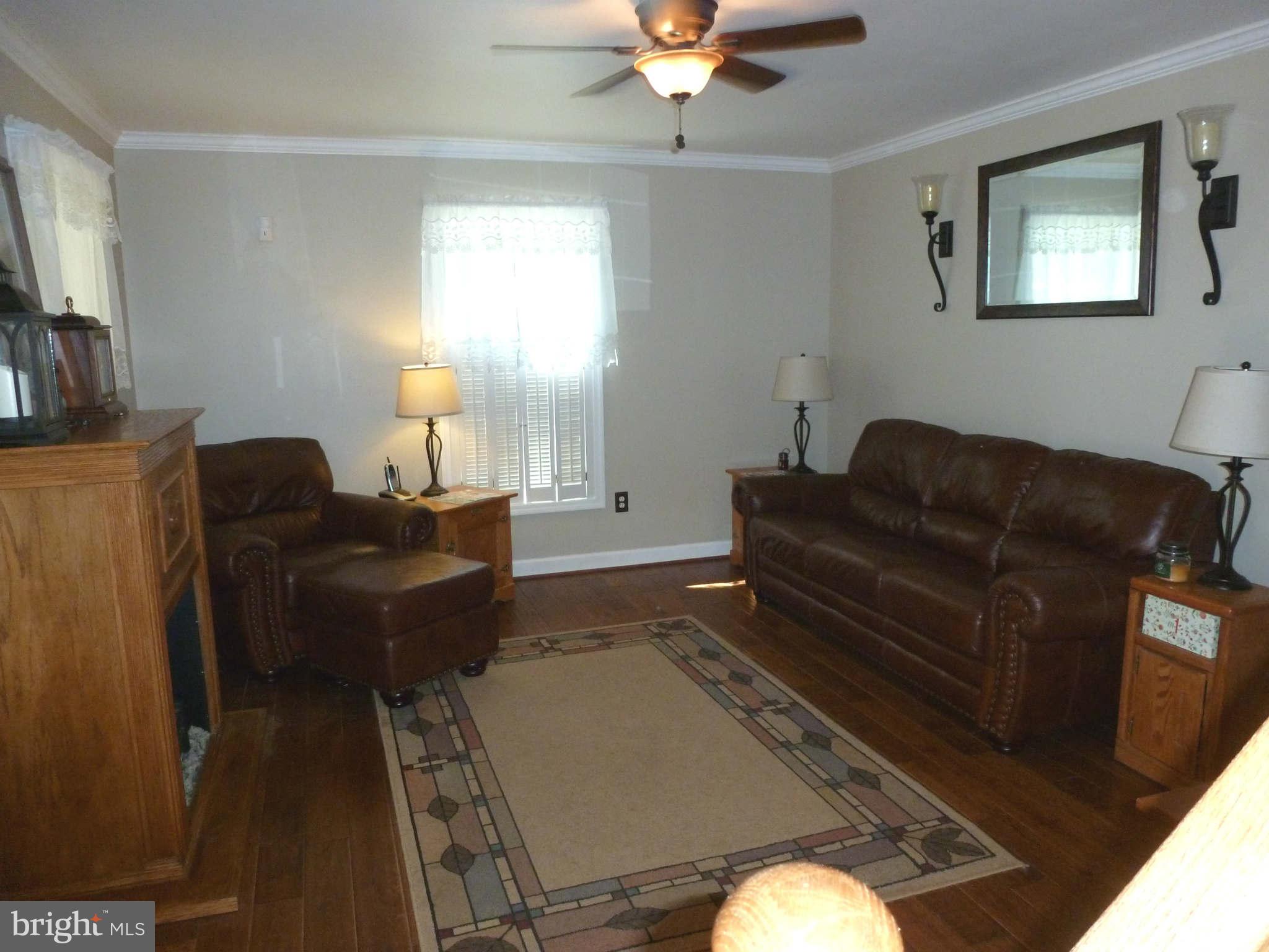 13600 Loy Wolfe Road Smithsburg, MD 21783 - Photo 9 of 28 Hand-scraped wood flooring & crown molding