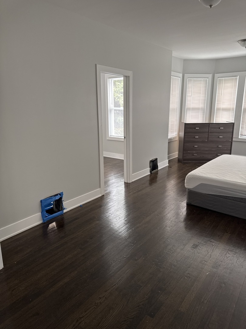 310 West 105th Street Chicago, IL 60628 - Photo 8 of 22 a living room with furniture and a wooden floor