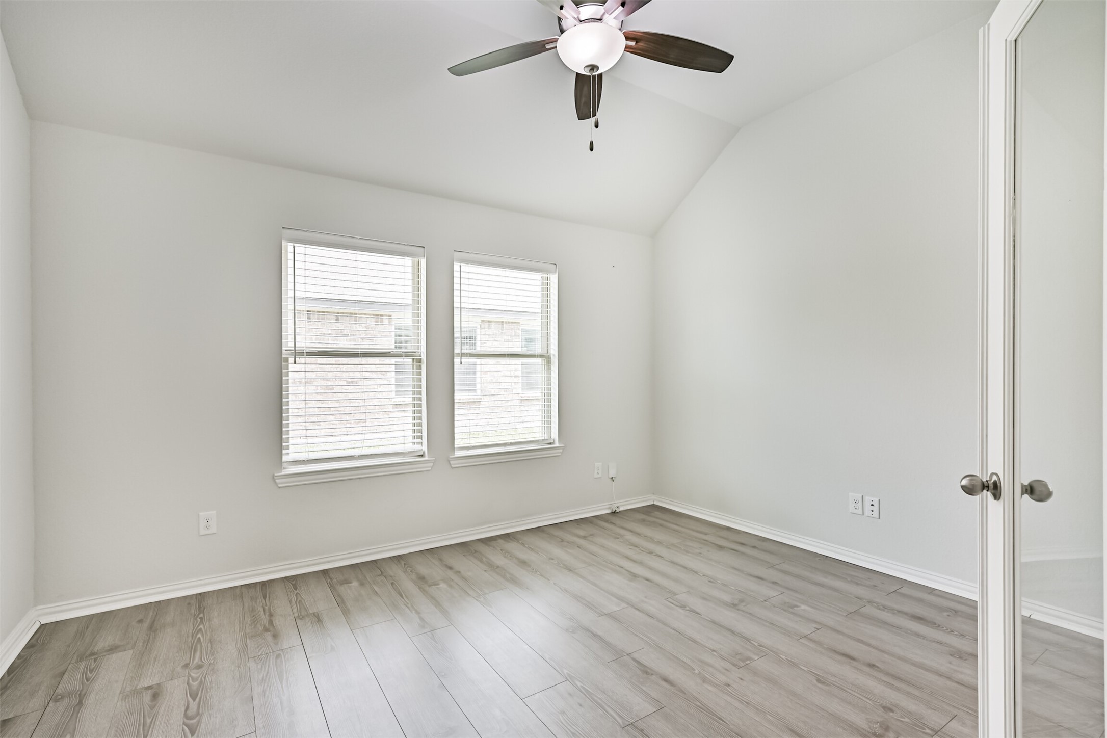 7019 Terra Drive Manvel, TX 77578 - Photo 7 of 41 wooden floor in an empty room with a window