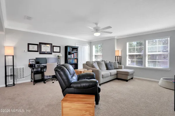 a living room with furniture and a couch