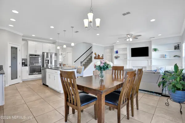 a view of a hallway view with living room and dining room