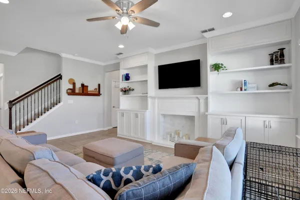 a living room with furniture and a flat screen tv