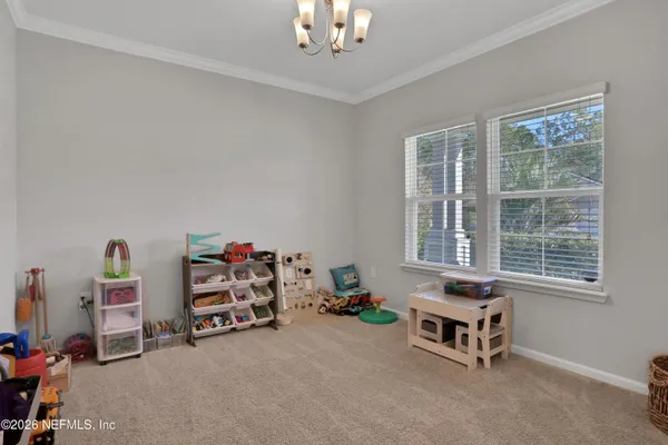 a bedroom with bed and a window