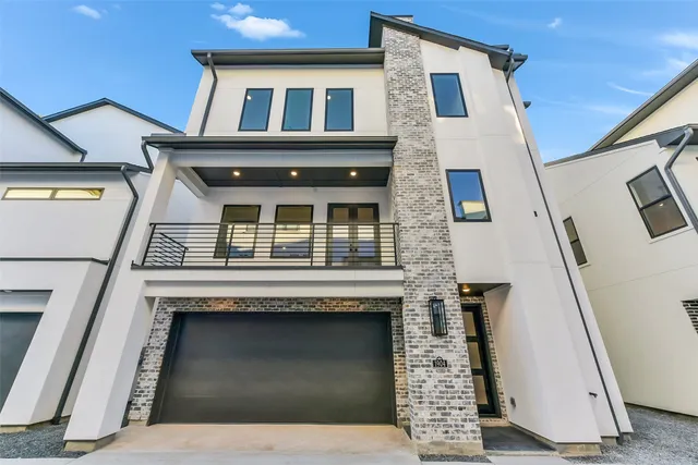 a view of a big house with many windows