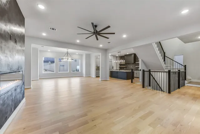 a view of a kitchen with a sink and a refrigerator
