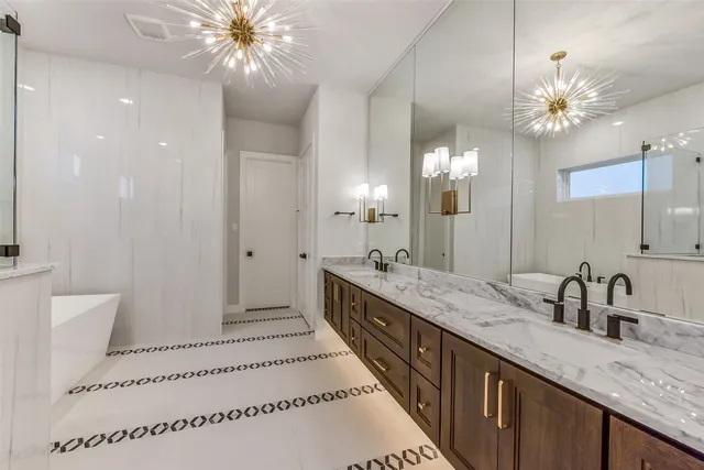 a bathroom with a double vanity sink and a mirror