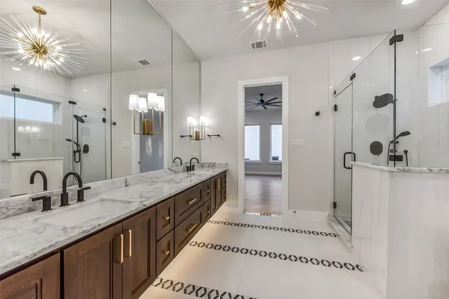 a bathroom with a double vanity sink and a mirror