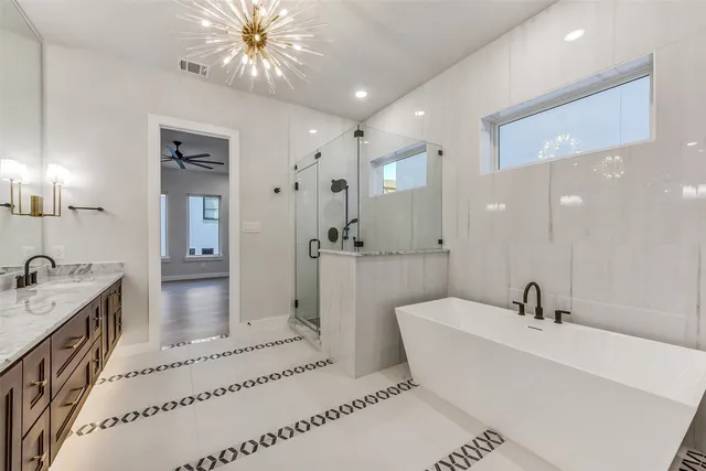 a bathroom with a double vanity sink mirror and shower