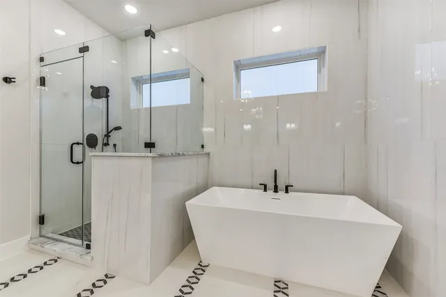 a bathroom with a sink a mirror and shower