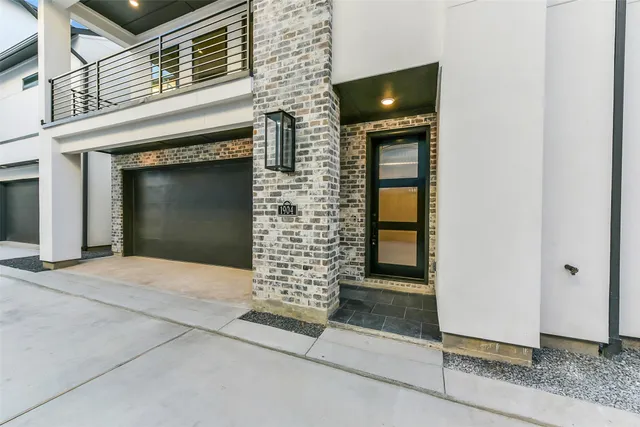 a front view of a house with a garage