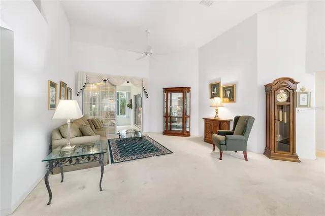 a dining room filled with furniture and a chandelier