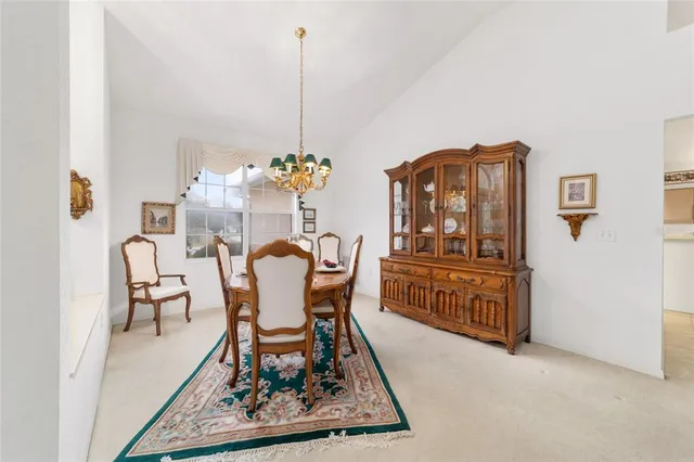 a kitchen with furniture and a chandelier