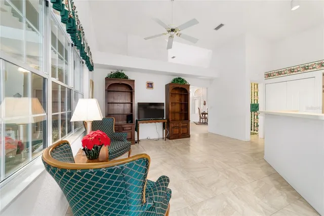 a kitchen with white cabinets and refrigerator