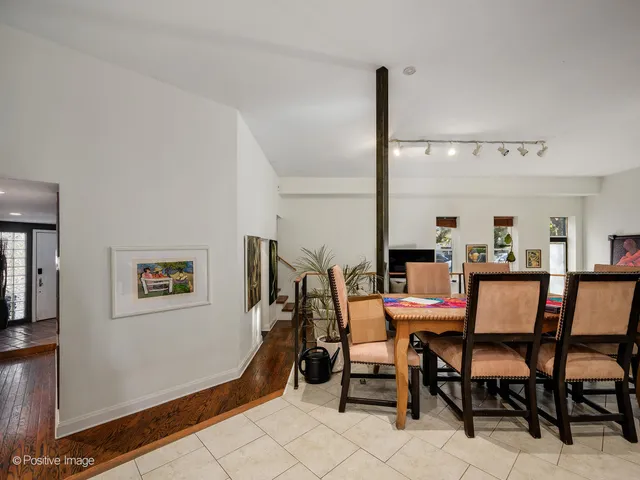 a dining room with furniture and window