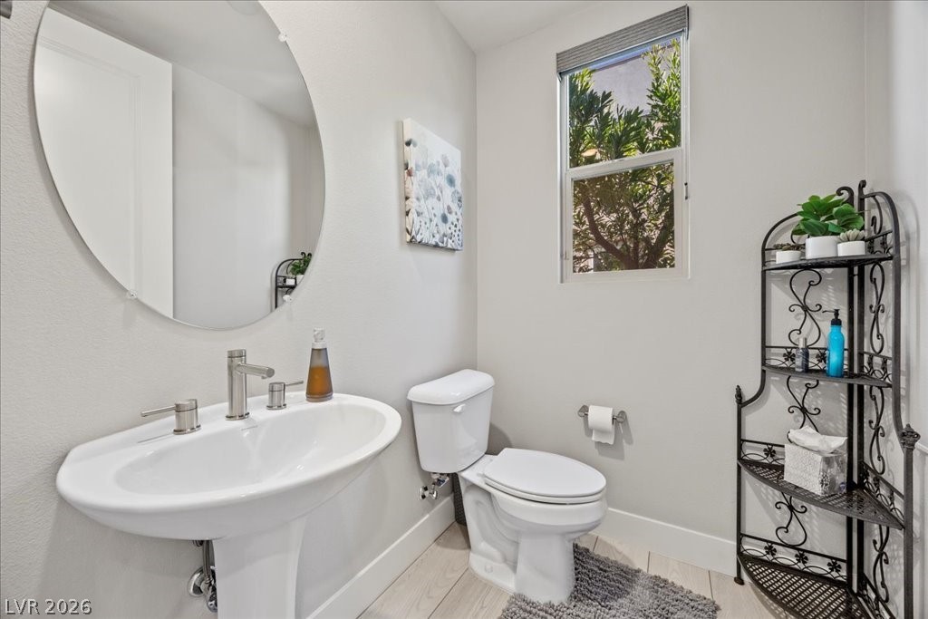 4262 Swift Street Las Vegas, NV 89135 - Photo 38 of 75 Half bathroom featuring baseboards