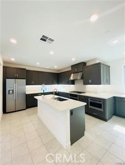 402 Transport Tustin, CA 92782 - Photo 11 of 26 a kitchen with stainless steel appliances a stove refrigerator and cabinets