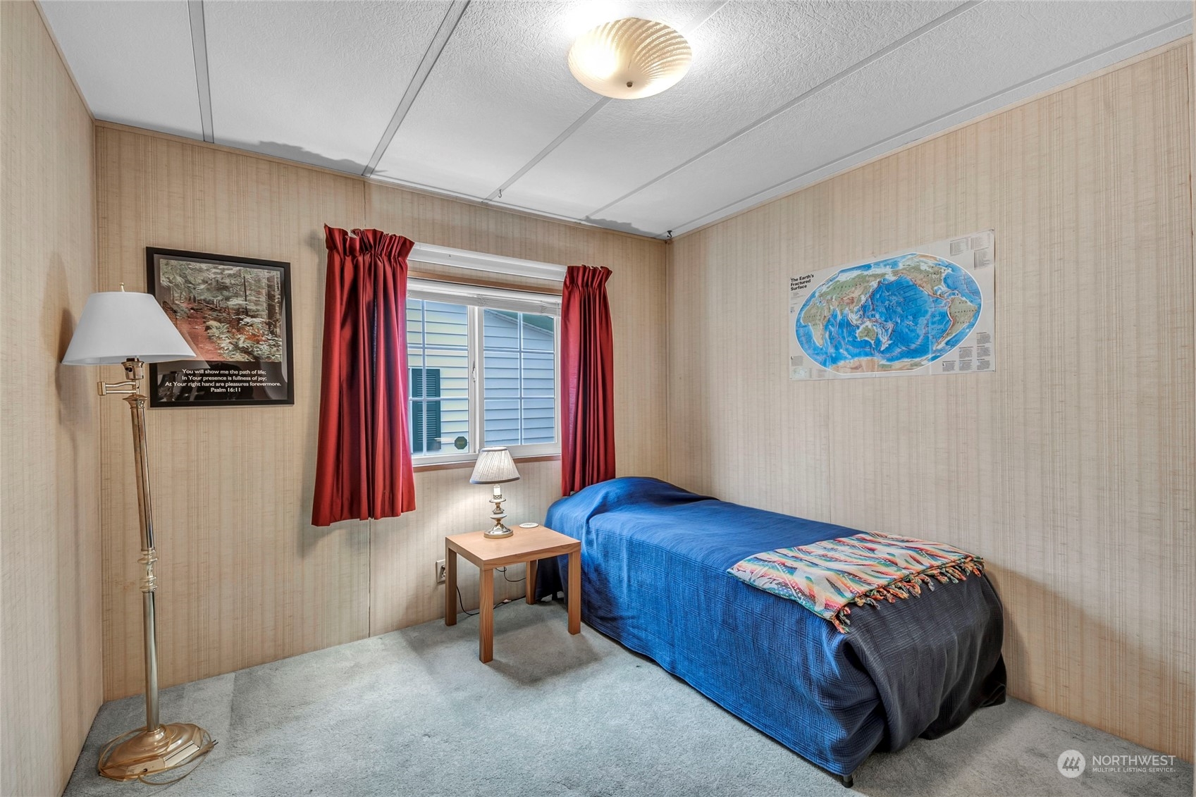 24106 10th Place West Bothell, WA 98021 - Photo 12 of 29 a bedroom with a bed and a painting on the wall