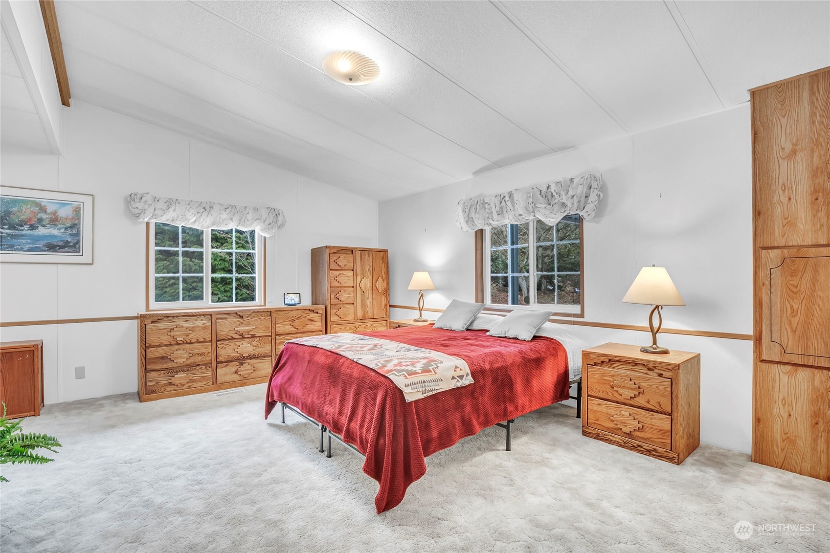 24106 10th Place West Bothell, WA 98021 - Photo 13 of 29 a bed sitting in a bedroom next to a window