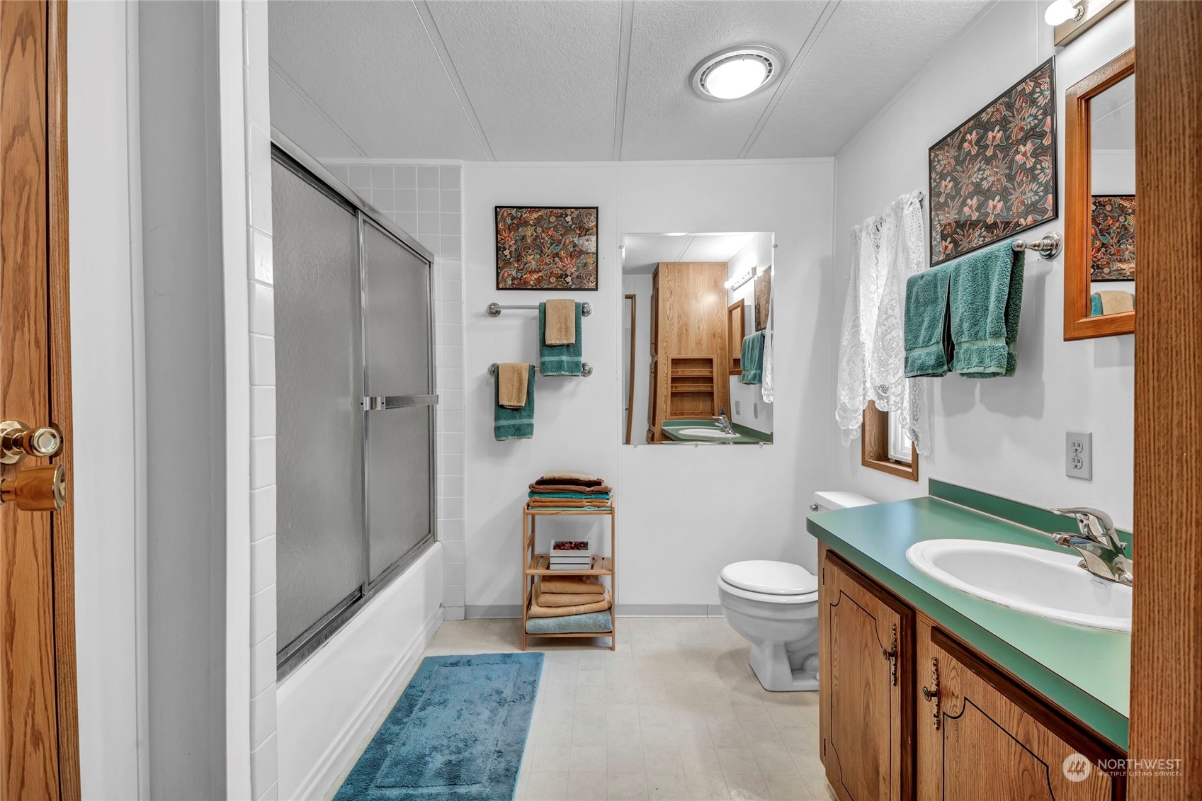 24106 10th Place West Bothell, WA 98021 - Photo 15 of 29 a spacious bathroom with a sink a toilet a mirror and shower