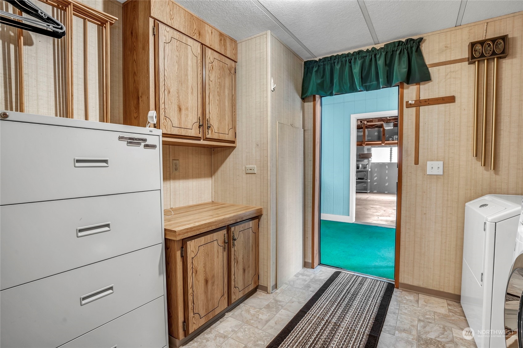 24106 10th Place West Bothell, WA 98021 - Photo 16 of 29 a view of a door with wooden walls