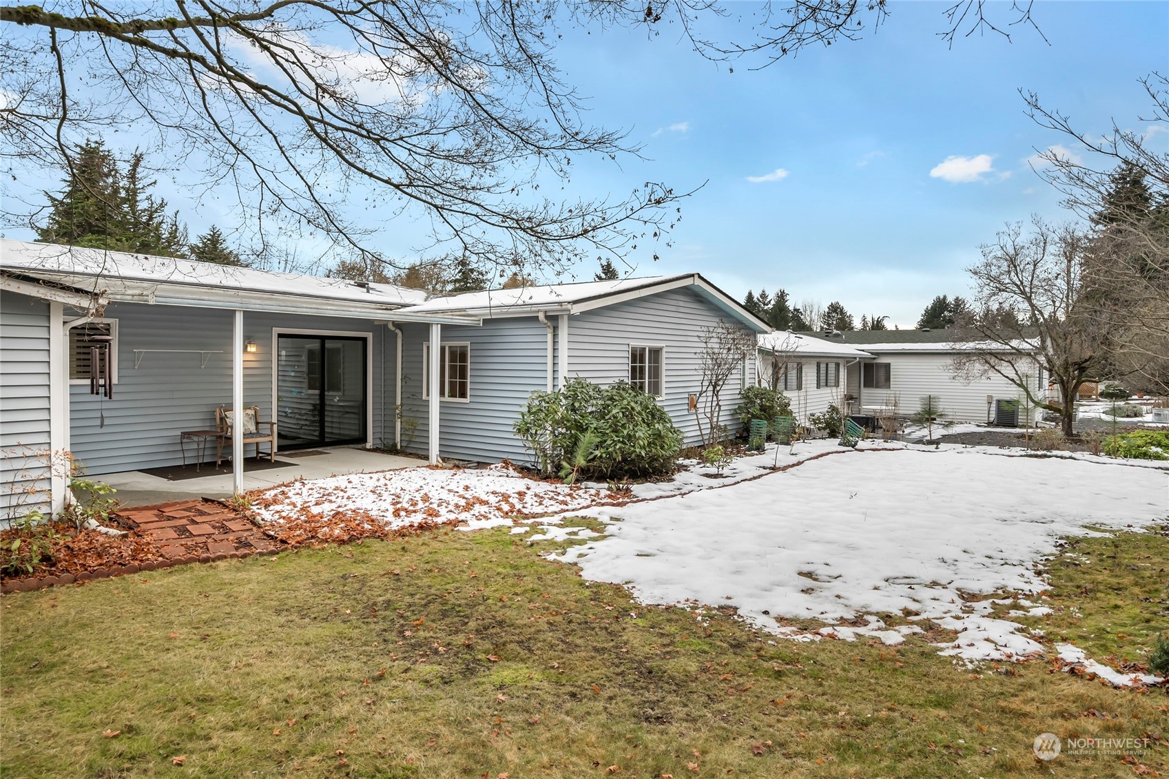 24106 10th Place West Bothell, WA 98021 - Photo 22 of 29 a front view of house with yard and trees in the background