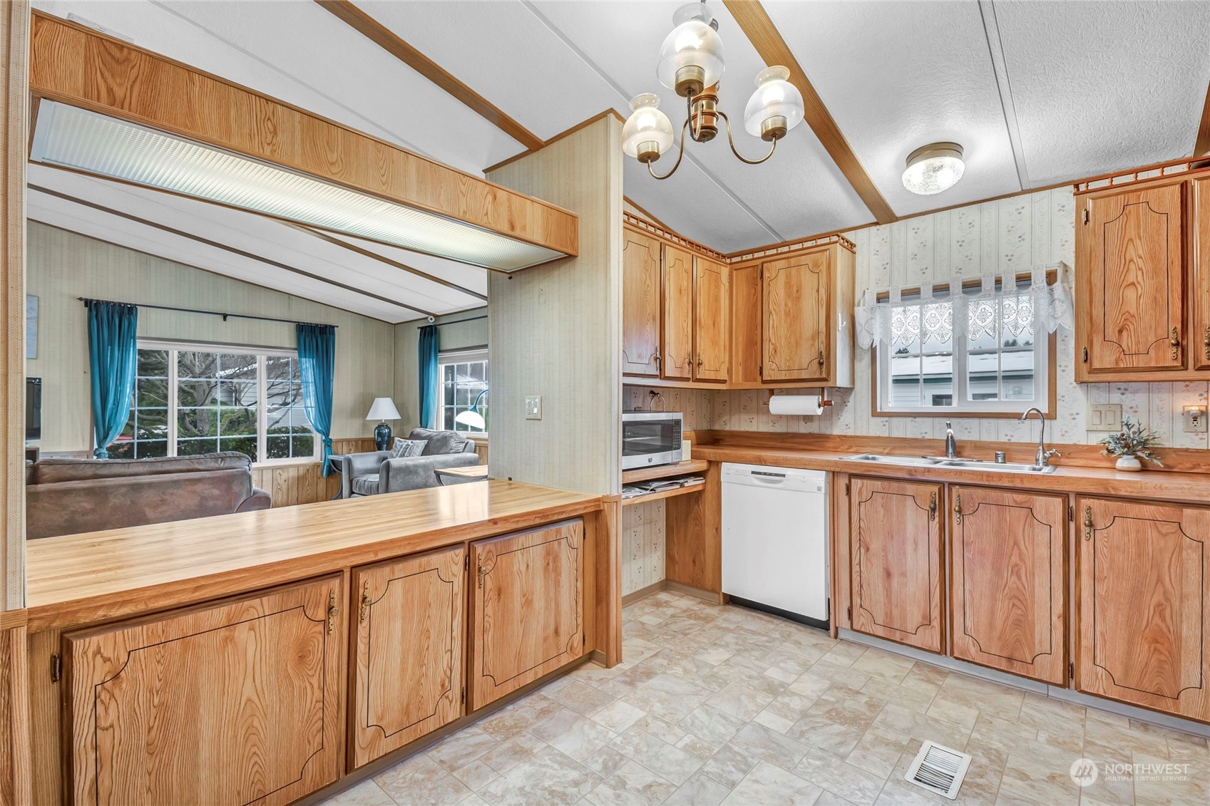 24106 10th Place West Bothell, WA 98021 - Photo 8 of 29 a large white kitchen with a large window