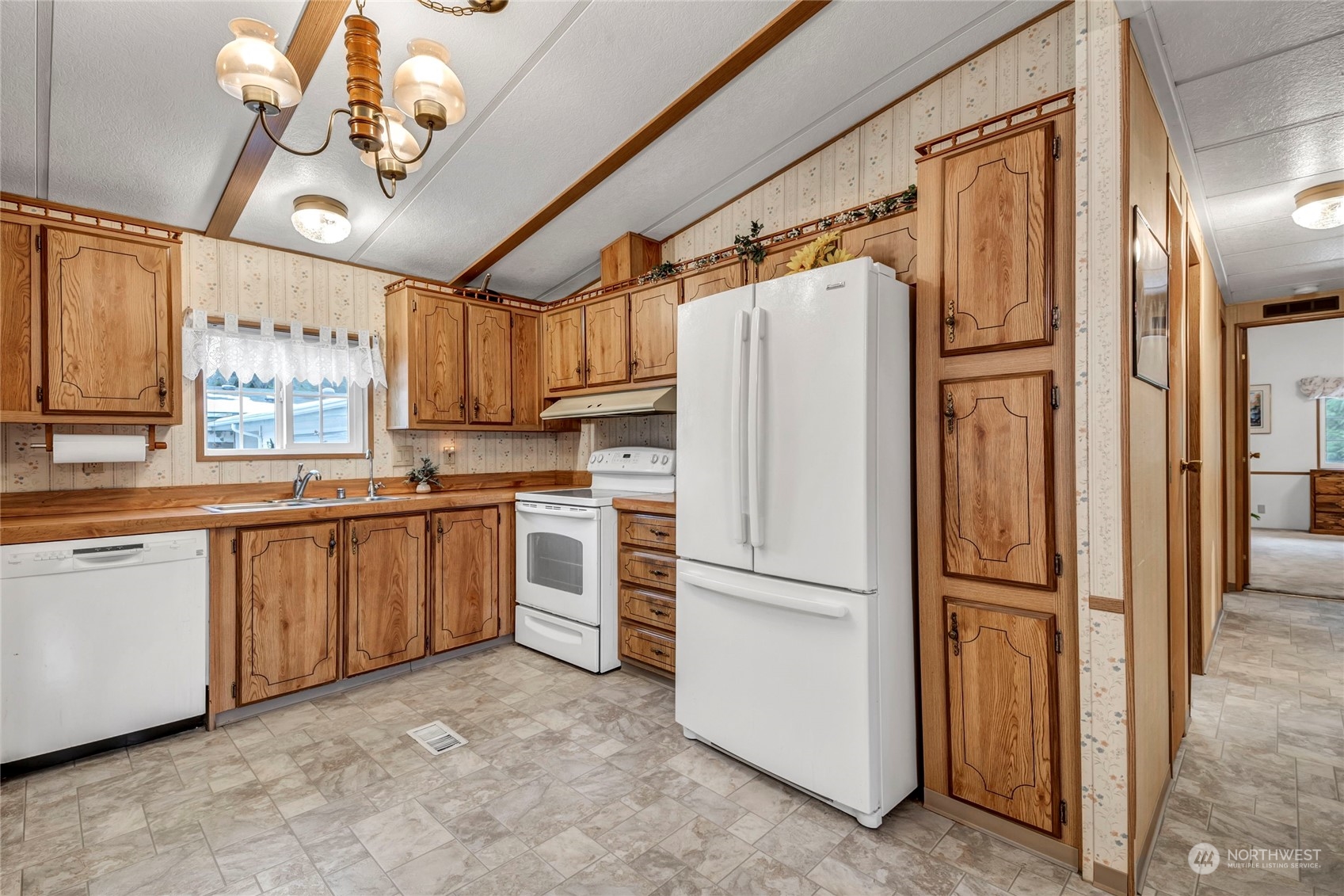24106 10th Place West Bothell, WA 98021 - Photo 9 of 29 a kitchen with granite countertop stainless steel appliances a refrigerator a sink and cabinets