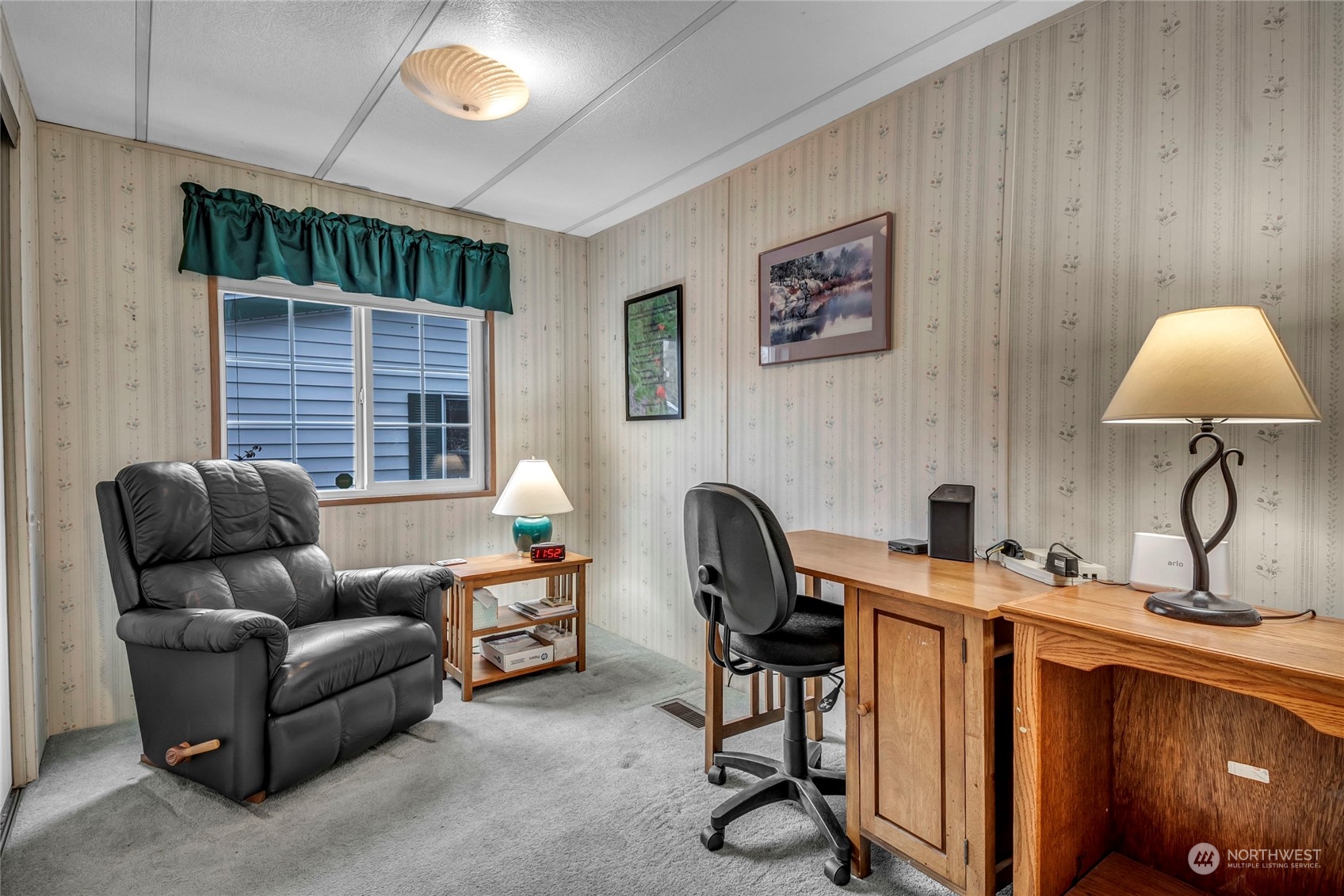 24106 10th Place West Bothell, WA 98021 - Photo 10 of 29 a living room with furniture a window and a lamp