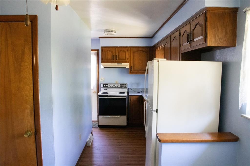 38 Wolfram Road Washington, PA 15301 - Photo 8 of 13 a kitchen with a refrigerator and a stove