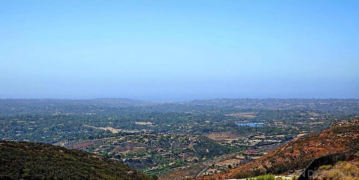 8737 Via Rancho Cielo, Unit 50 Rancho Santa Fe, CA 92067 - Photo 3 of 15 an aerial view of house with yard and mountain view in back