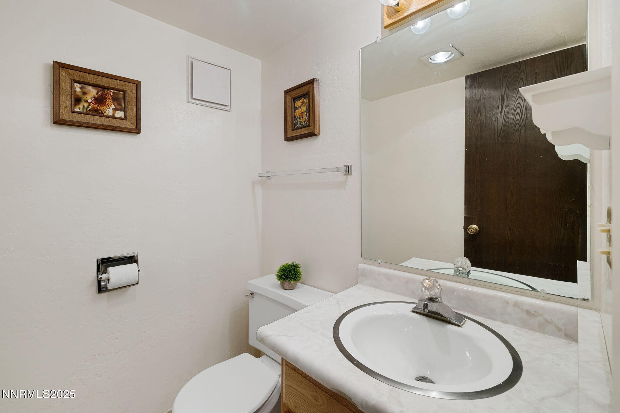 205 Clubhouse Circle Stateline, NV 89449 - Photo 11 of 27 a bathroom with a toilet a sink and mirror
