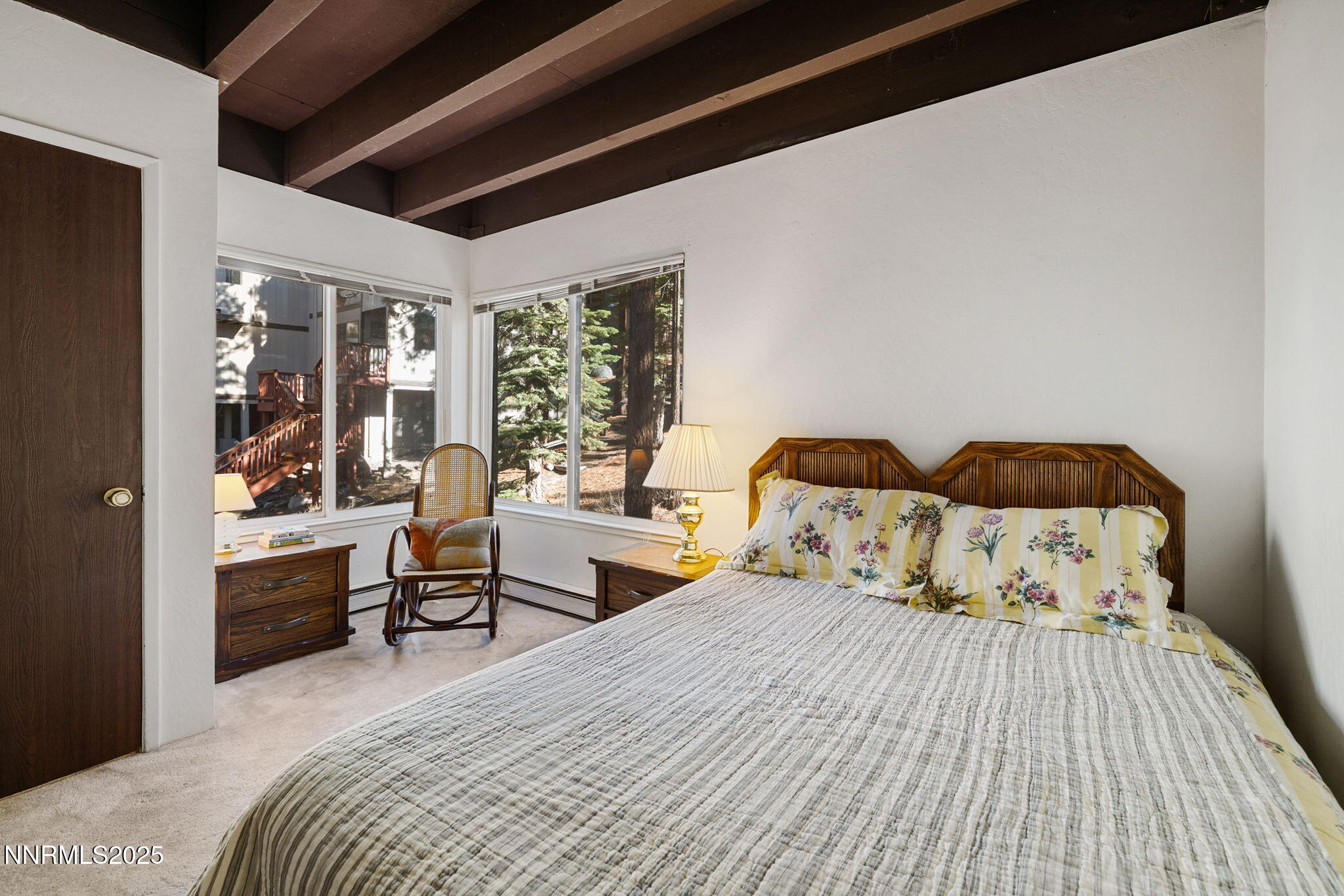 205 Clubhouse Circle Stateline, NV 89449 - Photo 13 of 27 a bedroom with a bed and wooden floor