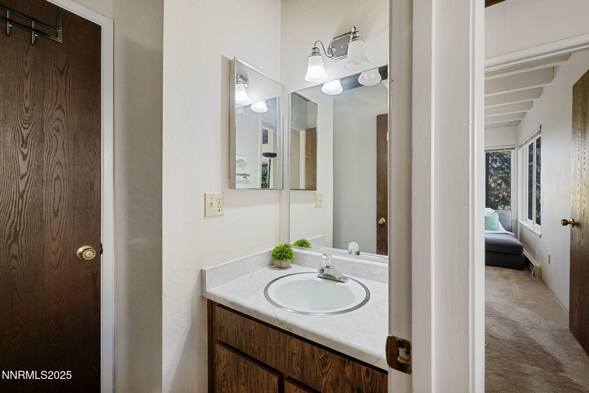 205 Clubhouse Circle Stateline, NV 89449 - Photo 14 of 27 a bathroom with a sink and a mirror