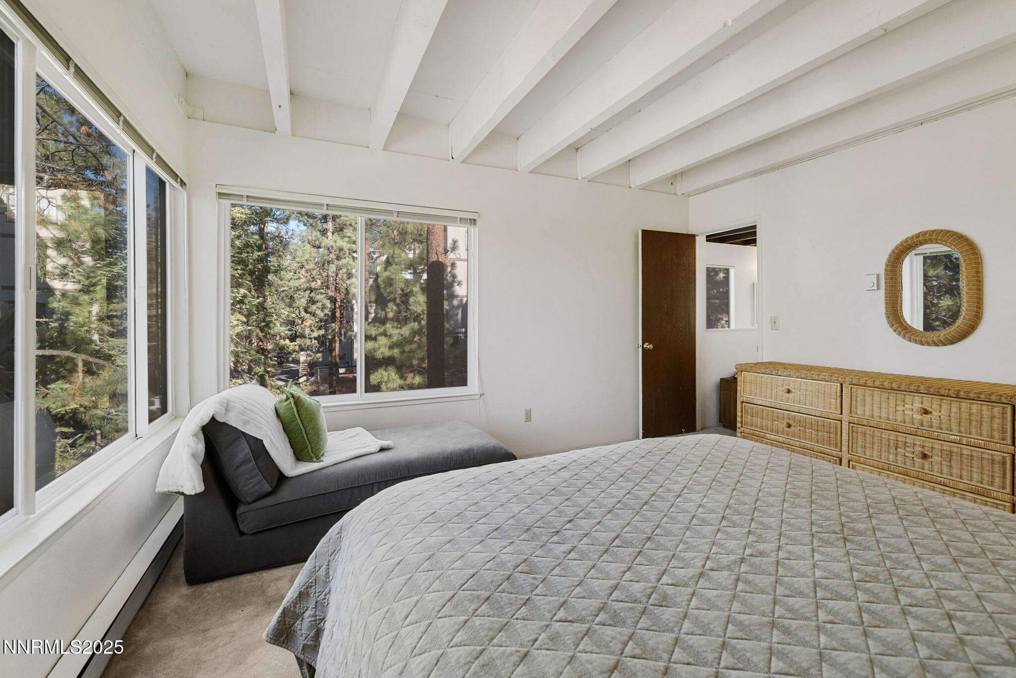 205 Clubhouse Circle Stateline, NV 89449 - Photo 16 of 27 a bedroom with a large bed and a large window