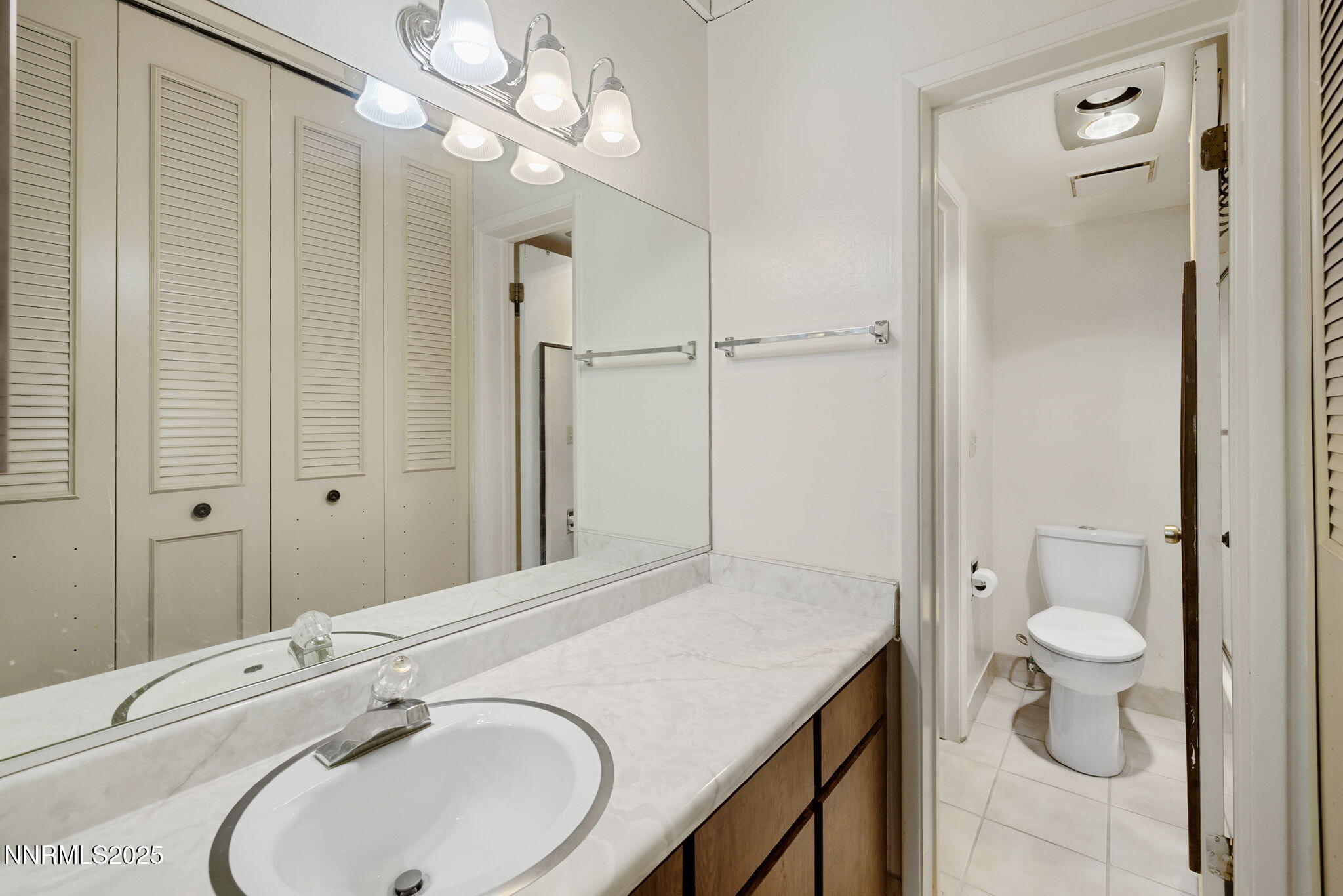 205 Clubhouse Circle Stateline, NV 89449 - Photo 17 of 27 a bathroom with a granite countertop sink a toilet and shower