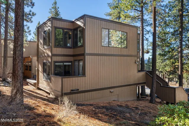 a view of a balcony with wooden fence and floor