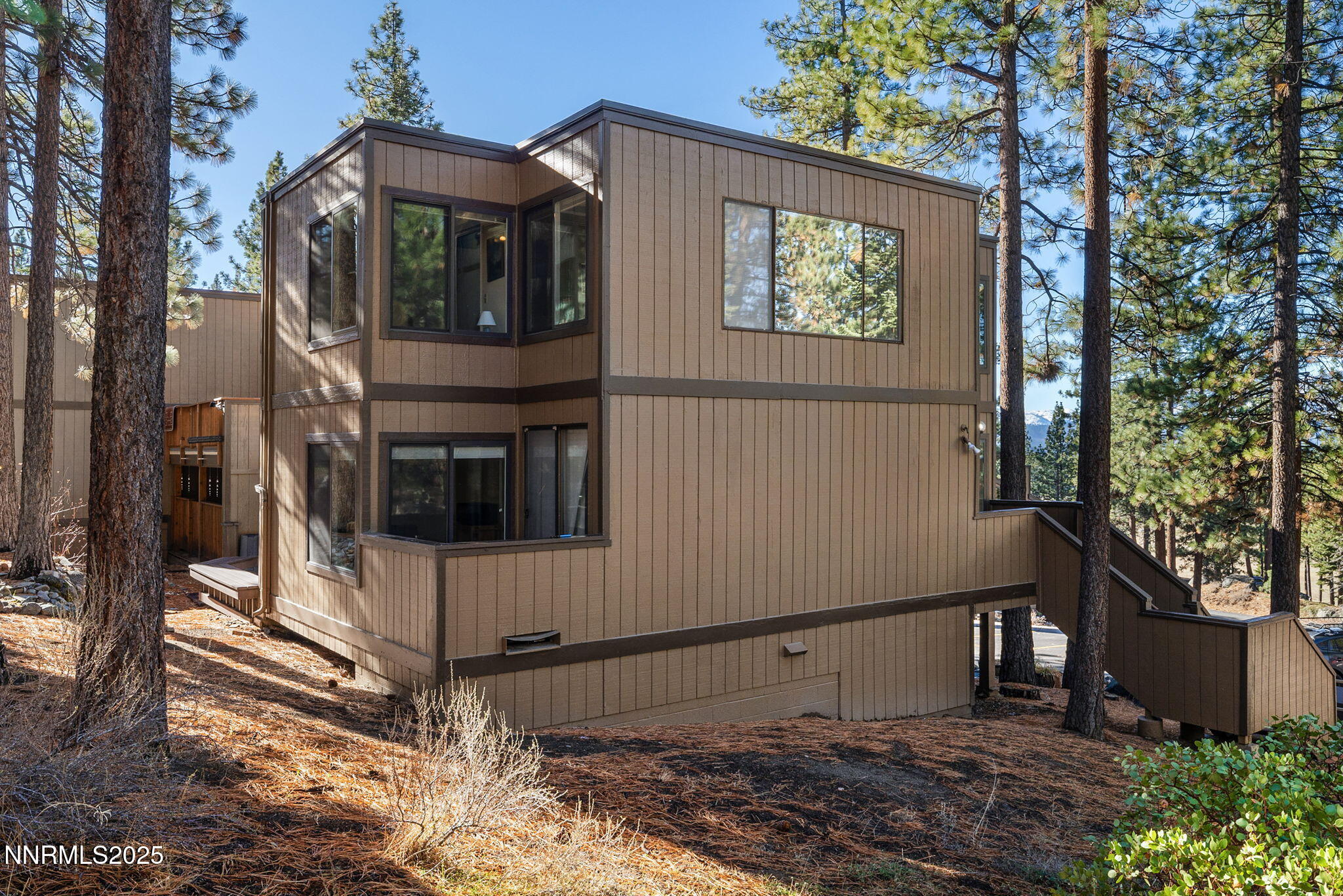 205 Clubhouse Circle Stateline, NV 89449 - Photo 18 of 27 a view of a house with a tree in the background
