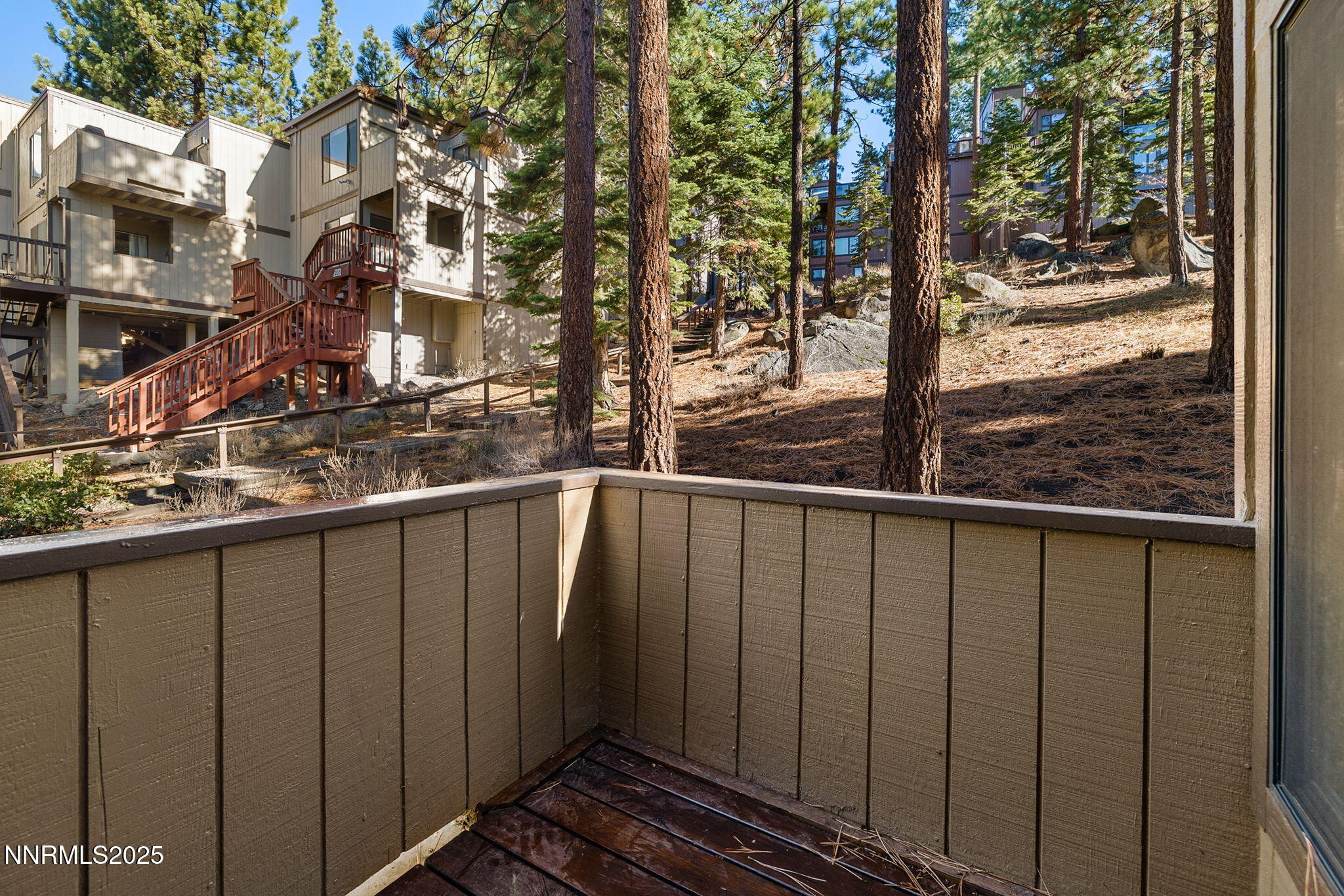 205 Clubhouse Circle Stateline, NV 89449 - Photo 19 of 27 a view of a balcony with wooden fence and floor