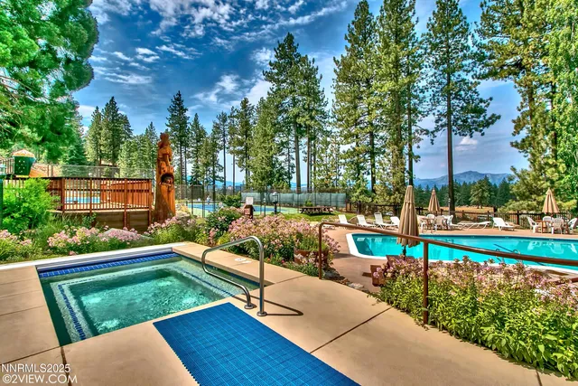a view of swimming pool with chairs