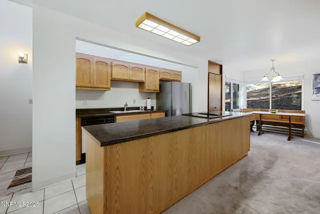 a living room with furniture a flat screen tv and a floor to ceiling window