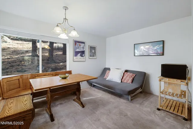 a room with pool table and windows