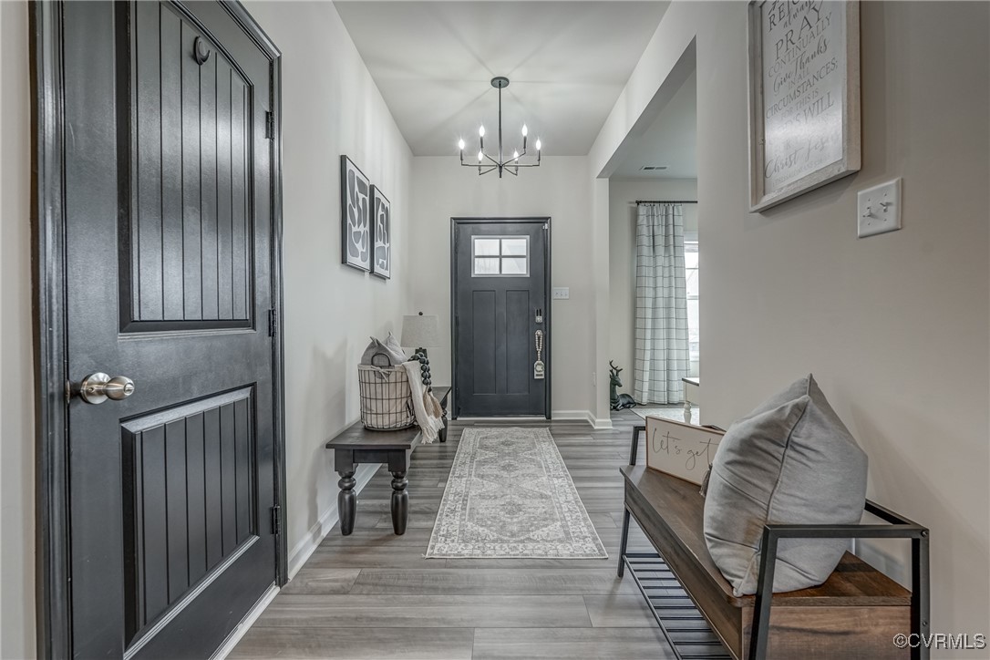 7004 Havering Way Henrico, VA 23231 - Photo 12 of 50 Foyer with an inviting chandelier and hardwood / w