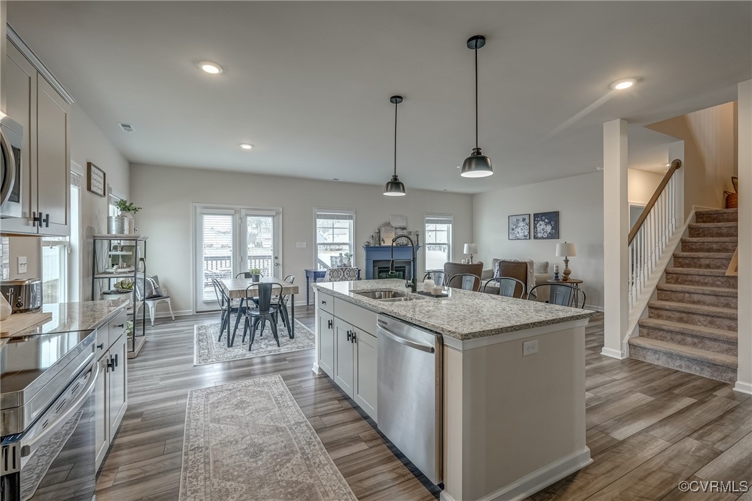 7004 Havering Way Henrico, VA 23231 - Photo 14 of 50 Kitchen with white cabinetry, decorative light fix