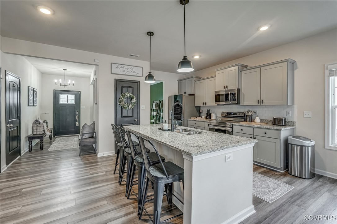 7004 Havering Way Henrico, VA 23231 - Photo 16 of 50 Kitchen with pendant lighting, a center island wit