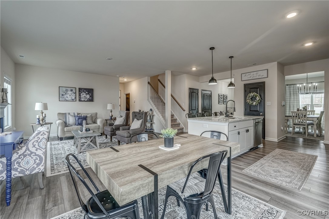 7004 Havering Way Henrico, VA 23231 - Photo 22 of 50 Dining room featuring a chandelier, sink, and ligh