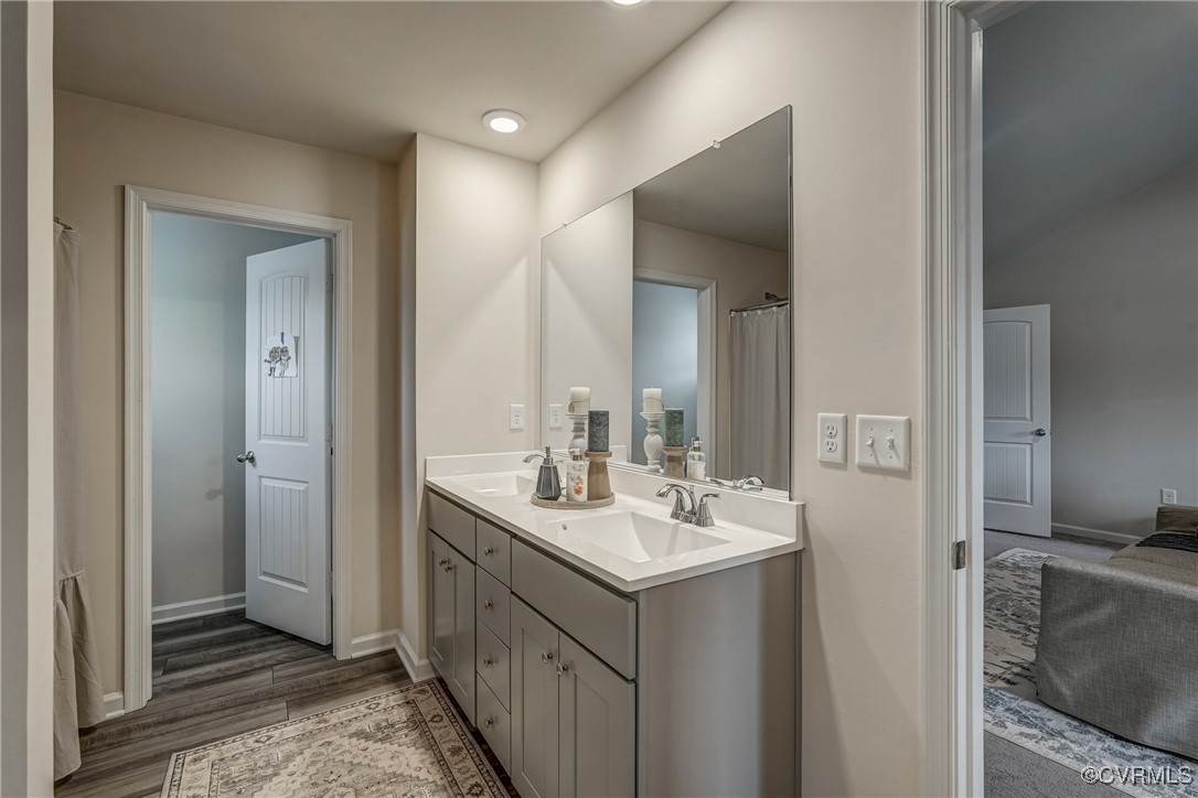 7004 Havering Way Henrico, VA 23231 - Photo 38 of 50 Bathroom featuring vanity and wood-type flooring