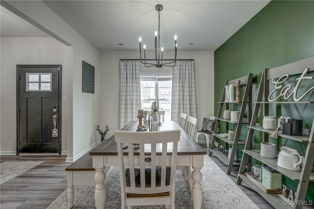 7004 Havering Way Henrico, VA 23231 - Photo 7 of 50 Dining area with an inviting chandelier and wood-t