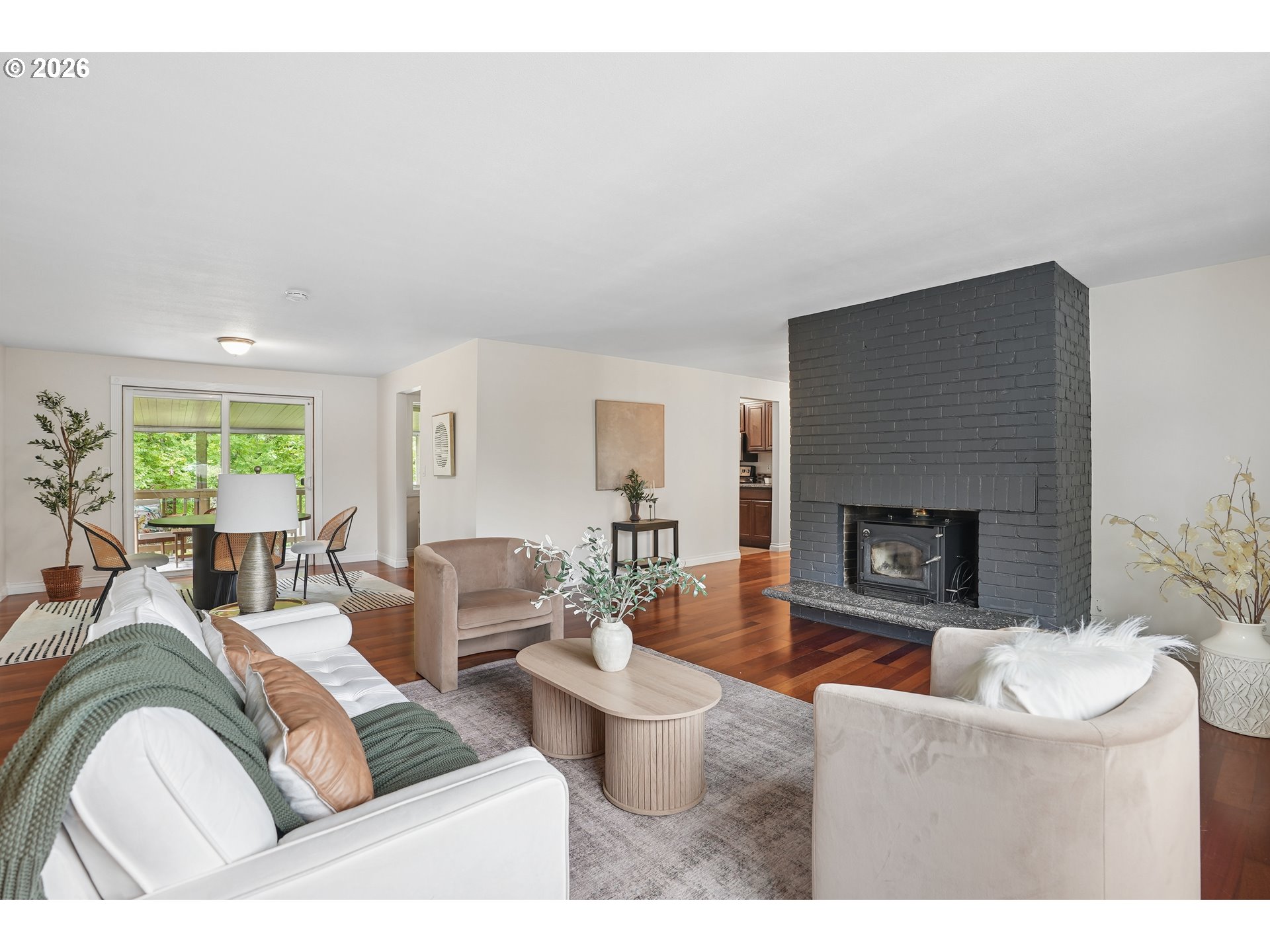 992 South South End Road Oregon City, OR 97045 - Photo 3 of 38 a living room with furniture a fireplace and a large window