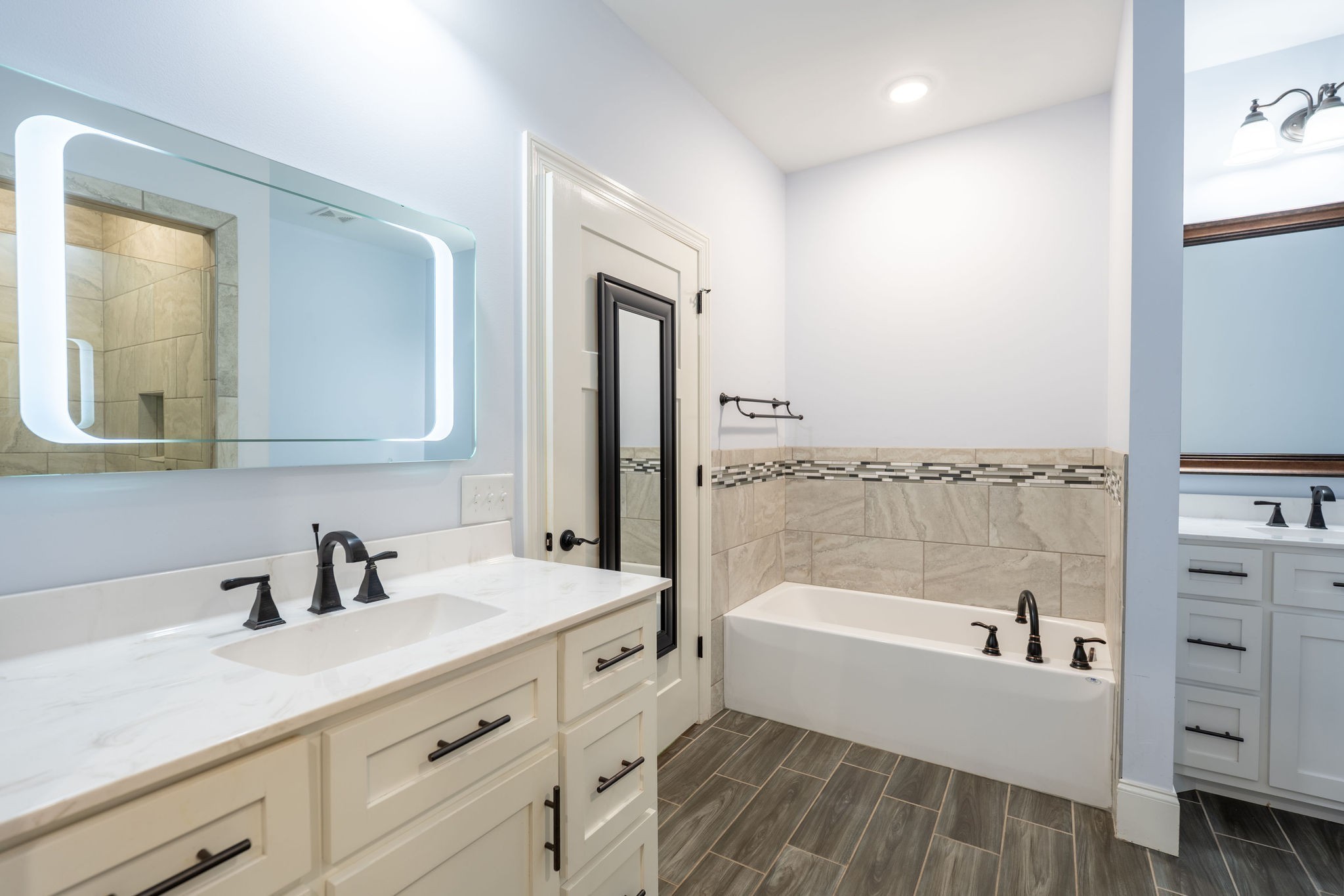 219 Waterloo Street Lawrenceburg, TN 38464 - Photo 15 of 39 a bathroom with a tub a sink and mirror